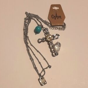 Rave Silver and Gold Pendant Necklace with Layered Charms